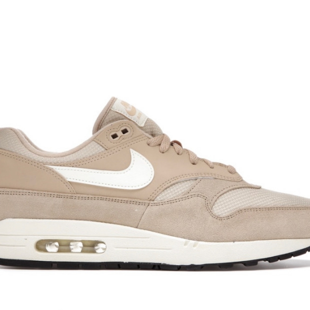 NIKE Air Max 1, Size 10, it has a Cream and Tan Color.